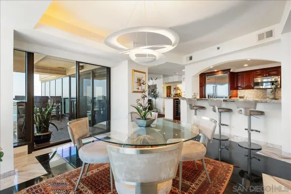 a dining room with furniture and wooden floor