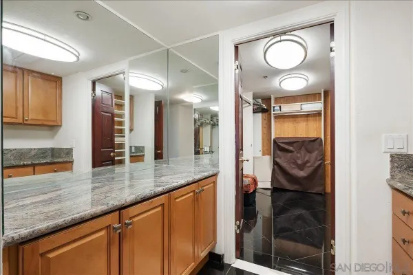 a kitchen with stainless steel appliances granite countertop a sink and cabinets