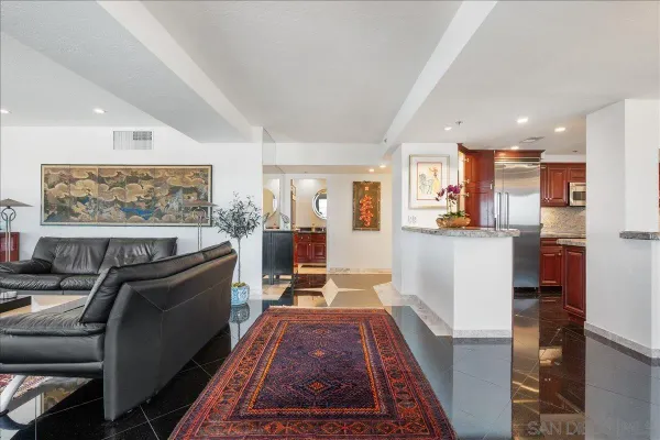 a living room with furniture and a rug