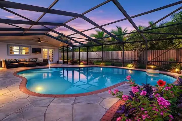 a view of a swimming pool with a yard