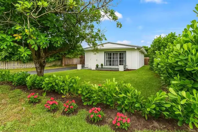 a house view with a garden space