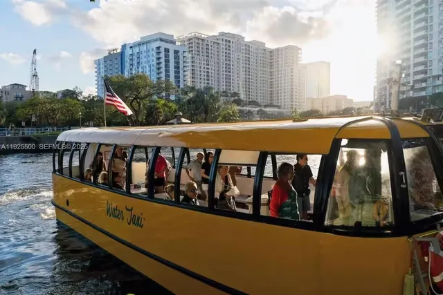 a view of a street with a cars parked on the road