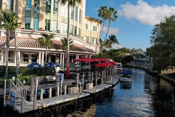 an aerial view of a house with a garden and pool