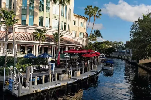 an aerial view of a house with a garden and pool