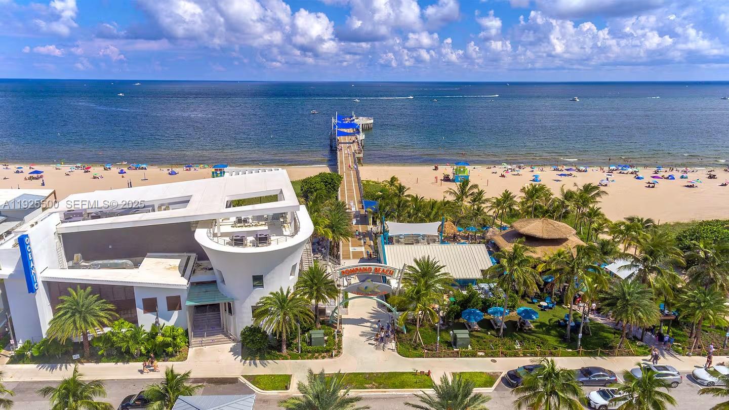 909 Northeast 7th Street Pompano Beach, FL 33060 - Photo 34 of 37 a view of a patio with table and chairs potted plants