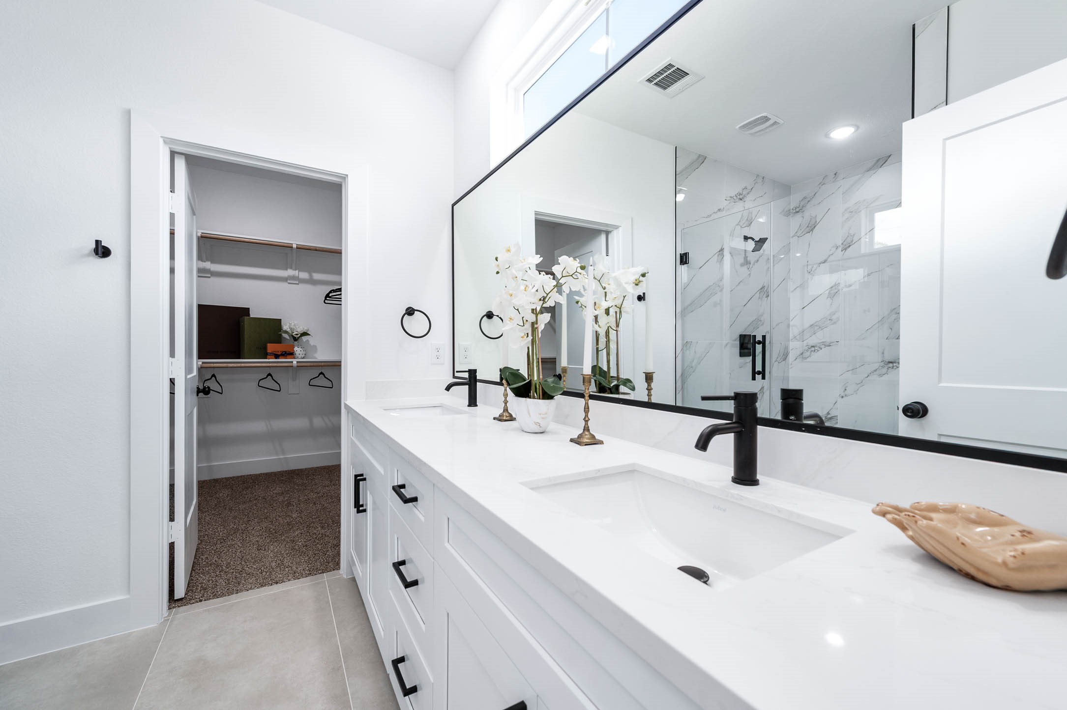 1515 Euel Street Houston, TX 77009 - Photo 27 of 34 Spa-inspired primary bathroom featuring a double vanity, sleek modern fixtures, and an expansive mirror that enhances both light and space.