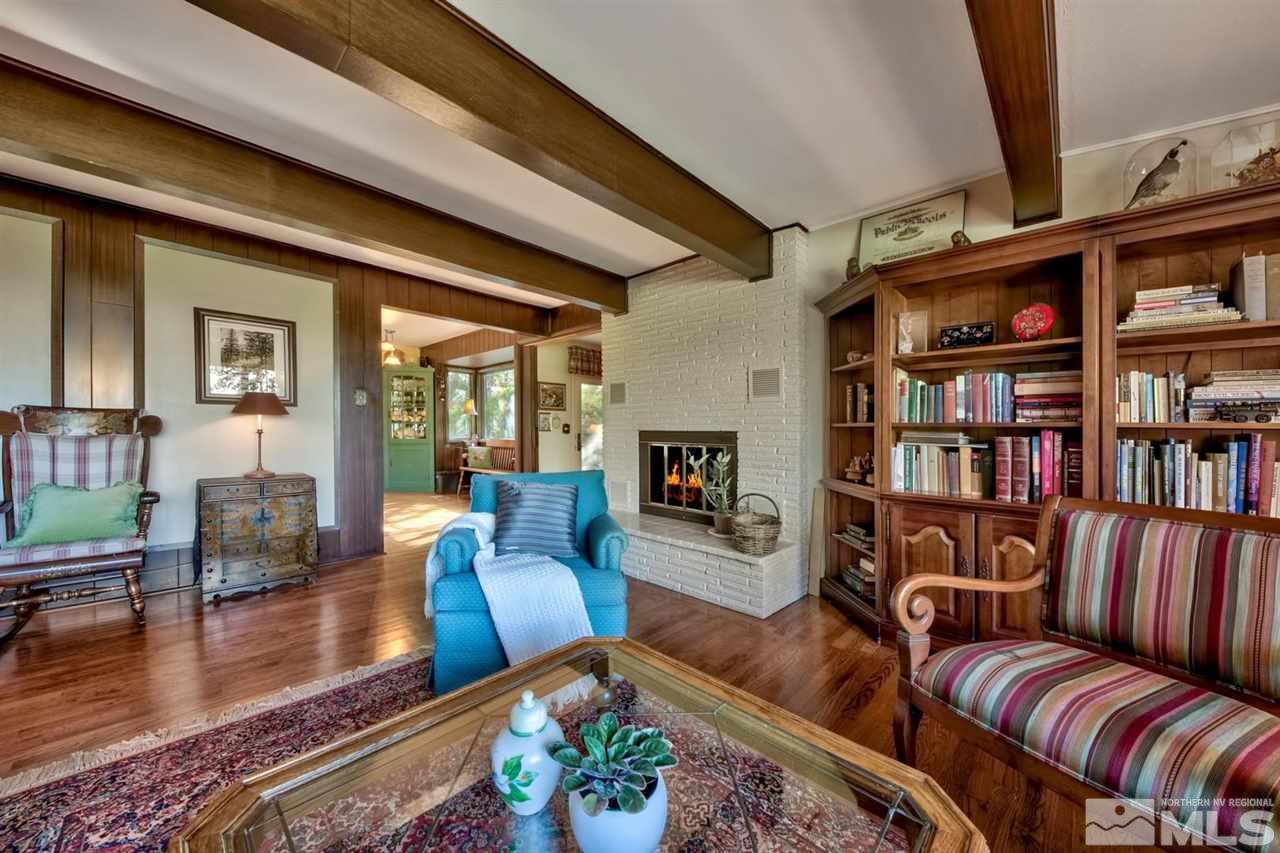 3550 Lamay Lane Reno, NV 89511 - Photo 12 of 25 a living room with furniture and a book shelf