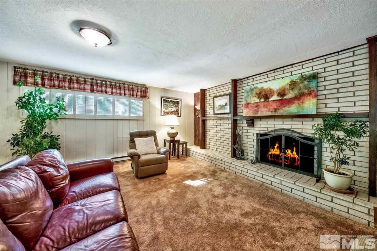 3550 Lamay Lane Reno, NV 89511 - Photo 15 of 25 a living room with furniture and a fireplace
