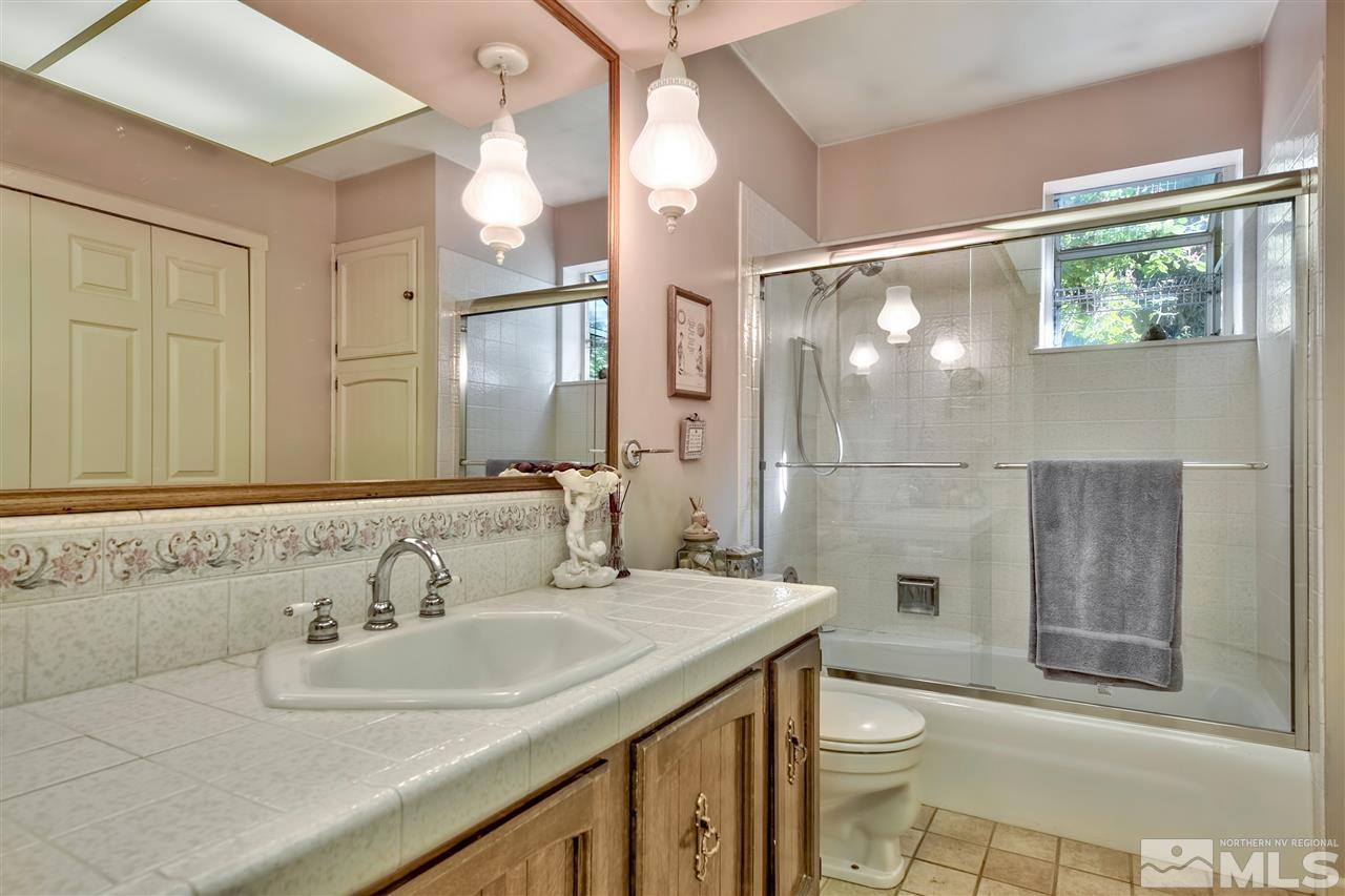 3550 Lamay Lane Reno, NV 89511 - Photo 23 of 25 a bathroom with a sink toilet and shower