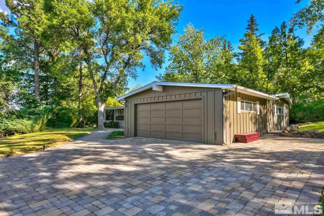 3550 Lamay Lane Reno, NV 89511 - Photo 3 of 25 a front view of a house with a yard and garage