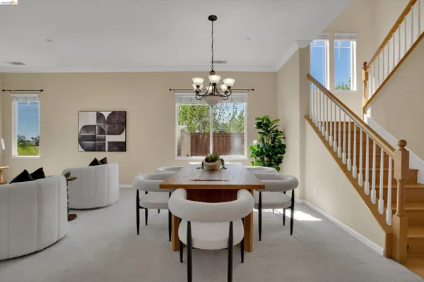 a view of a dining room with furniture window and chandelier
