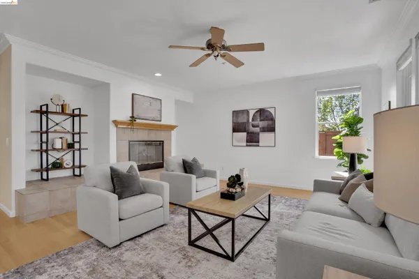 a living room with furniture and a fireplace