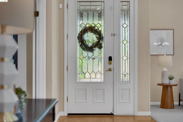 a view of hallway with wooden floor