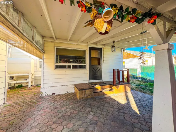 a view of a porch with wooden floor