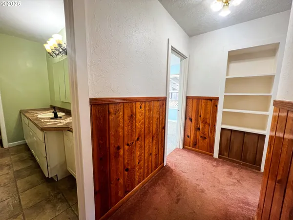 a view of a hallway with closet