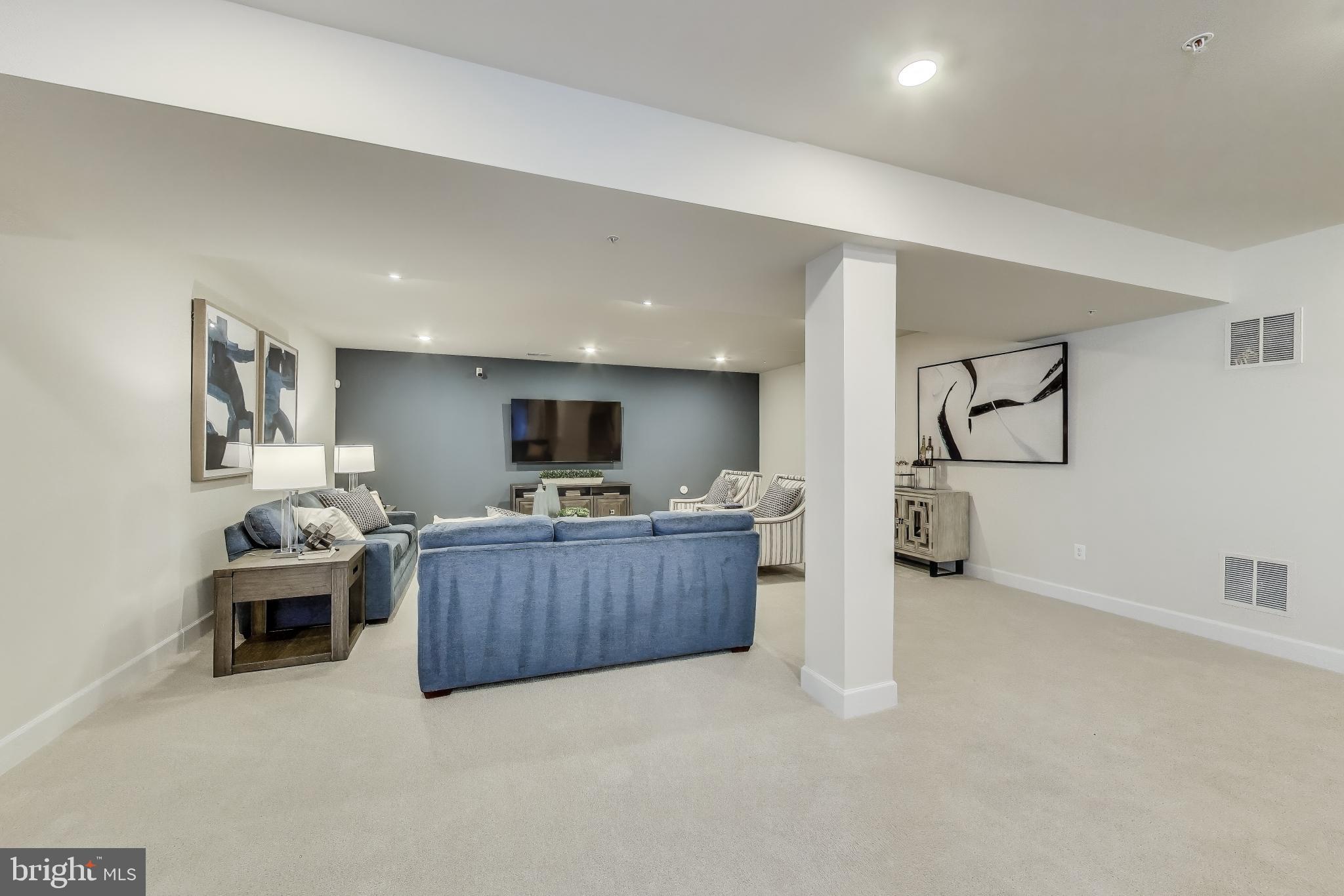 141 Collington Place Laurel, MD 20708 - Photo 12 of 15 a living room with furniture and a flat screen tv