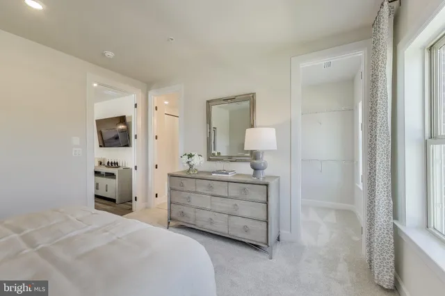 a room with a bed and a mirror