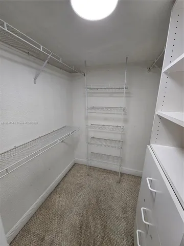 a view of an empty walk in closet