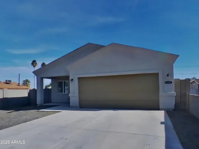 a backyard of a house with shaded area