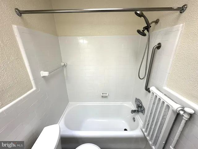 a bathroom with a shower and a shower