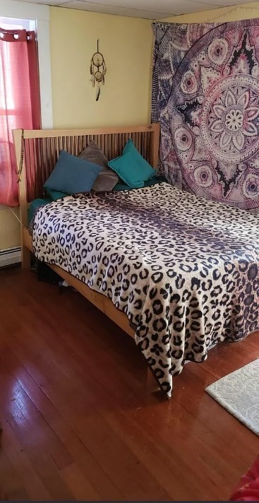 49 Main Street, Unit C Maynard, MA 01754 - Photo 8 of 9 a picture of a bedroom with wooden floor