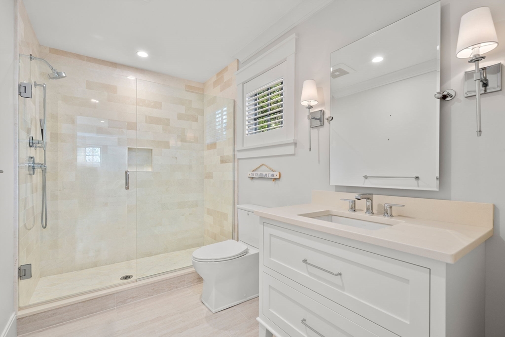 22 Temple Road Wellesley, MA 02482 - Photo 26 of 41 a bathroom with a sink a toilet and shower