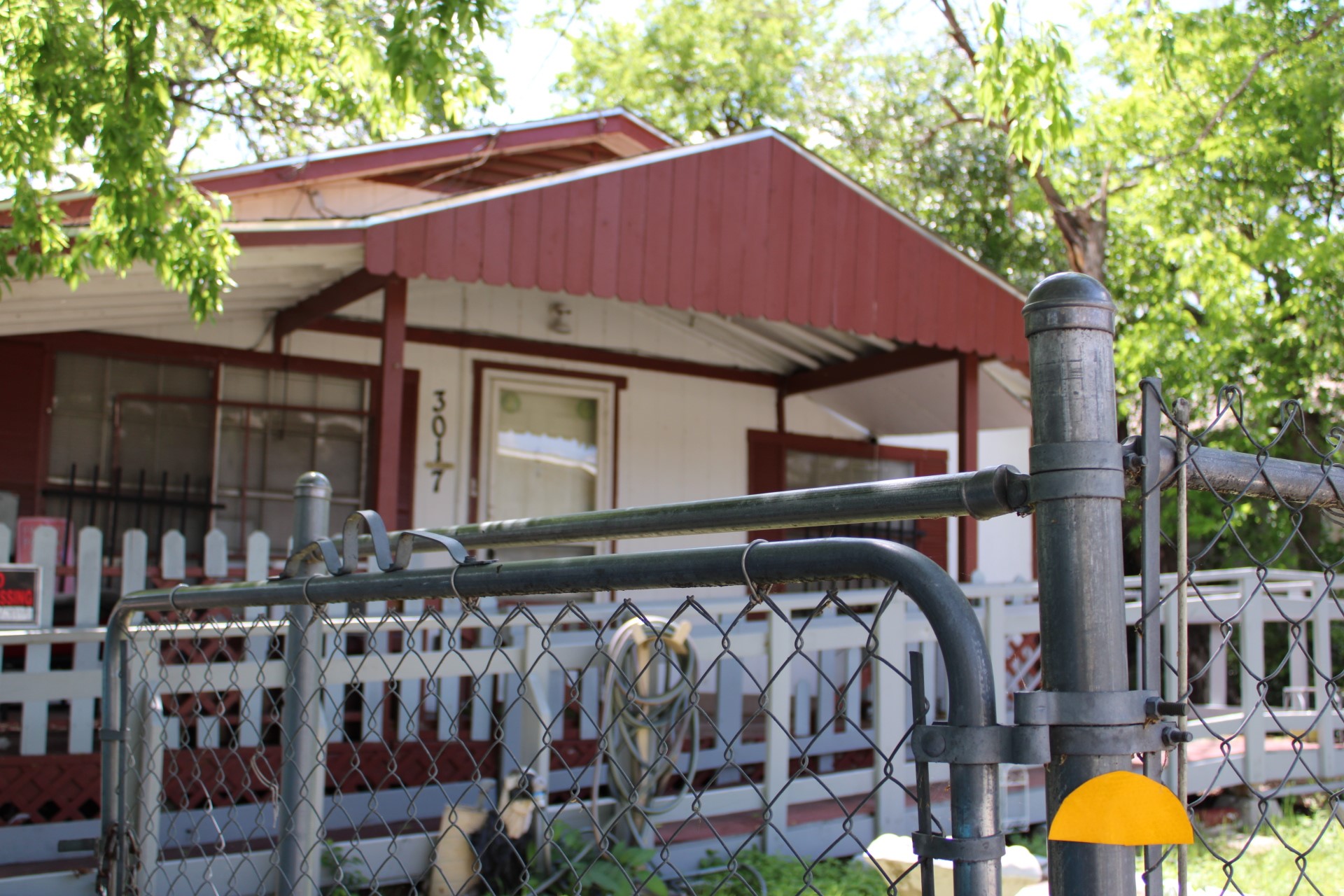 3017 Lyons Road Austin, TX 78702 - Photo 2 of 16 a house with trees in front of it