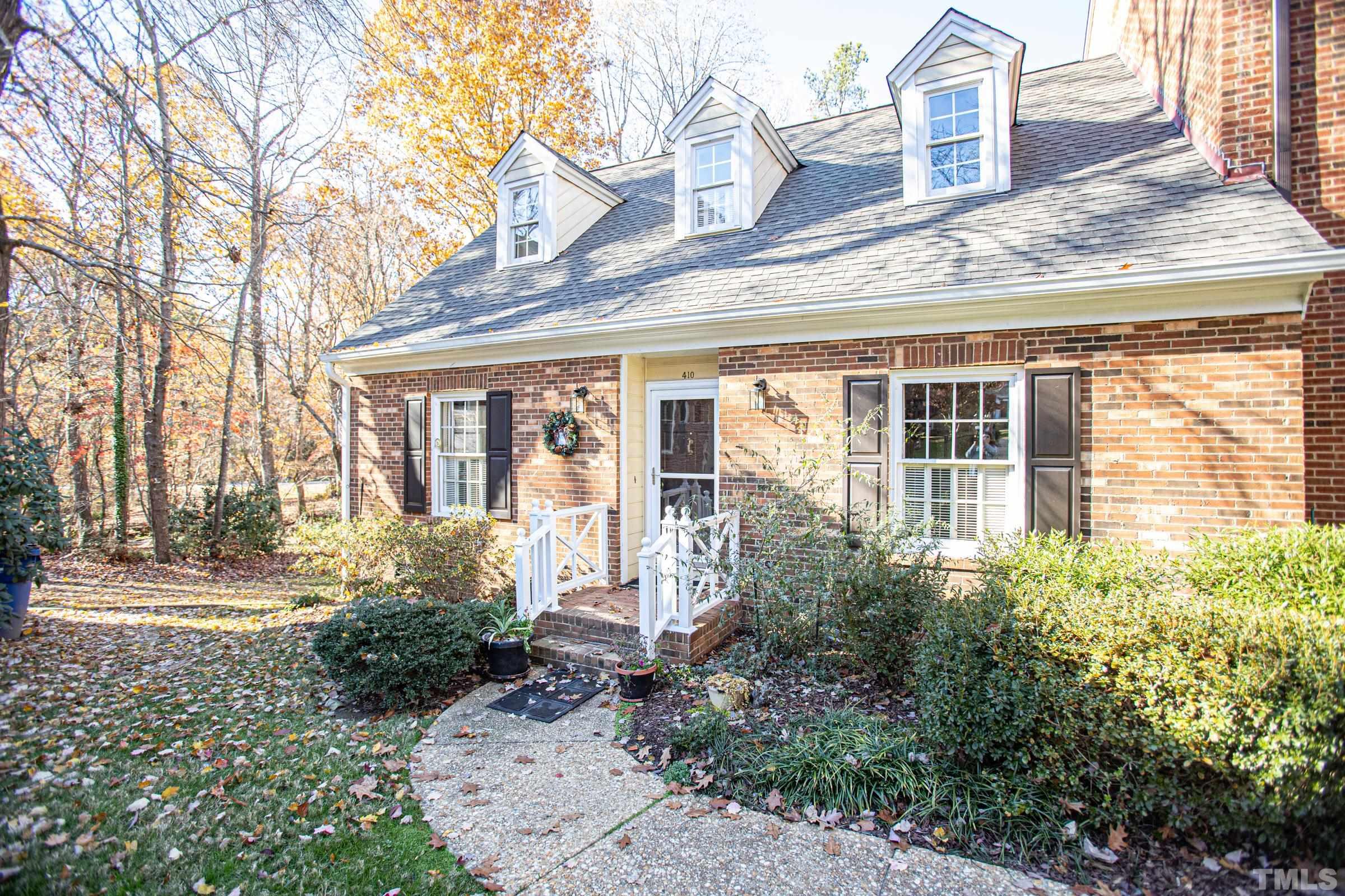 410 Weathergreen Drive Raleigh, NC 27615 - Photo 2 of 44 a view of a house with a garden and plants