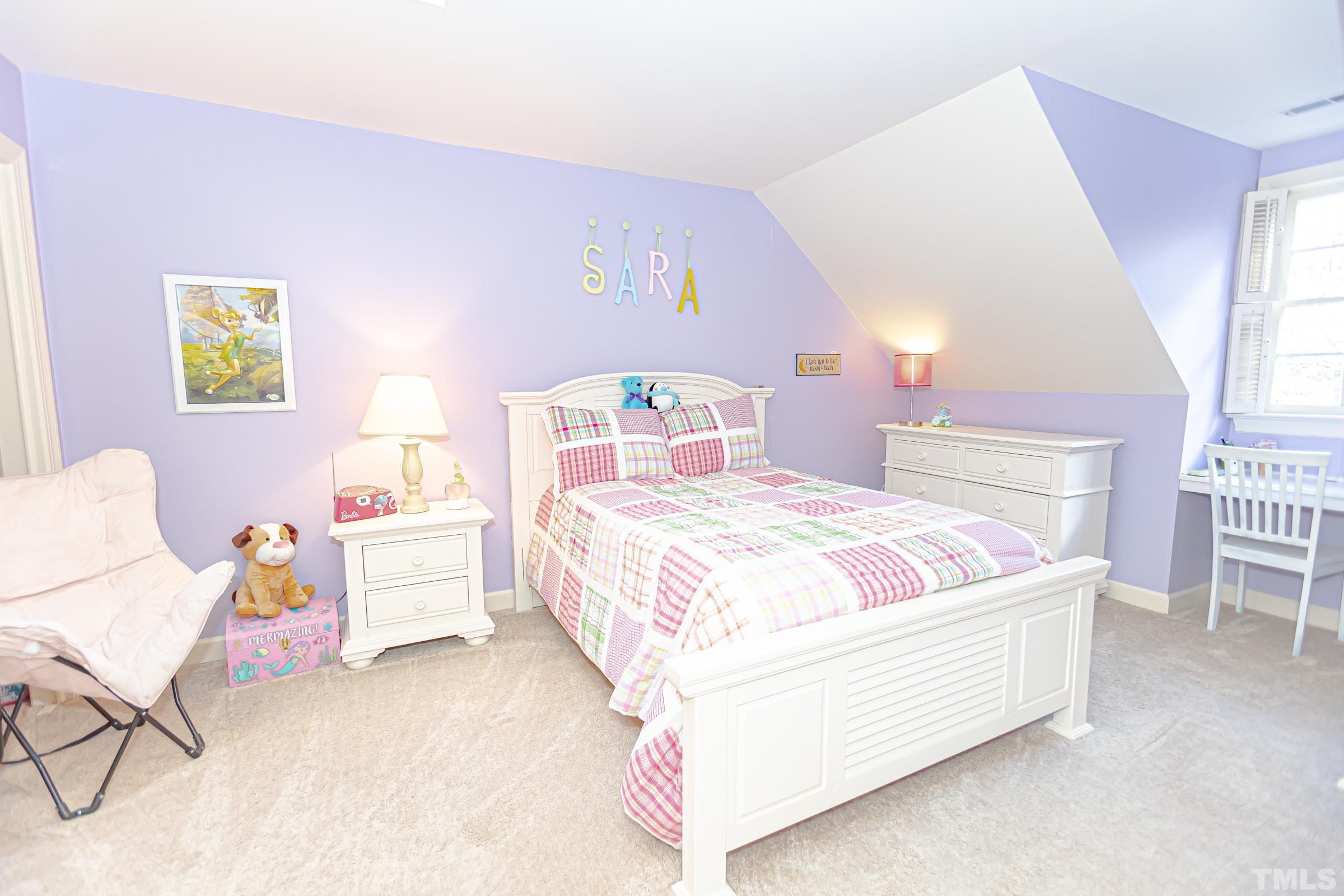 410 Weathergreen Drive Raleigh, NC 27615 - Photo 29 of 44 a bedroom with a bed and a chair