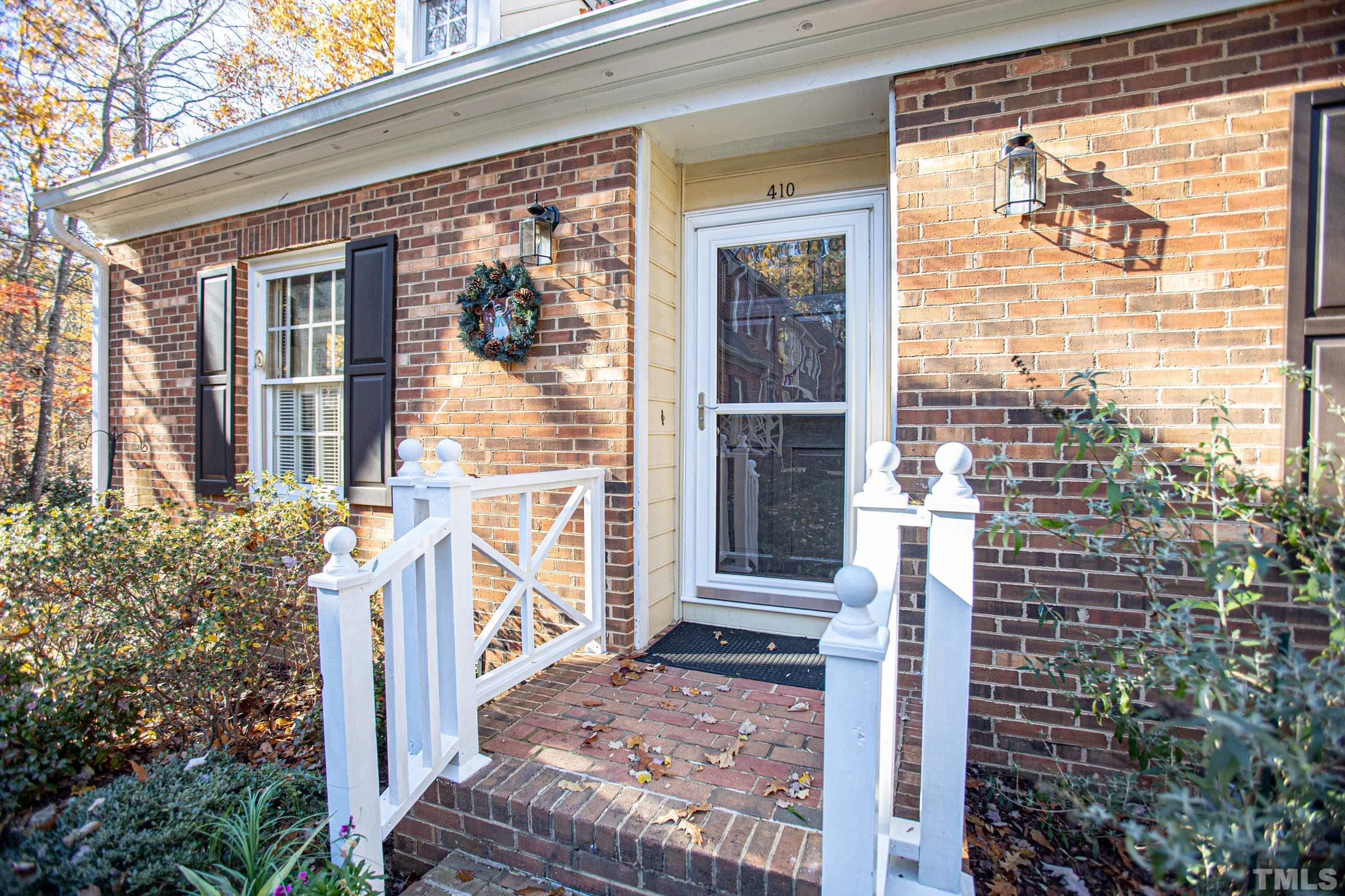 410 Weathergreen Drive Raleigh, NC 27615 - Photo 3 of 44 a front view of a house with a large window