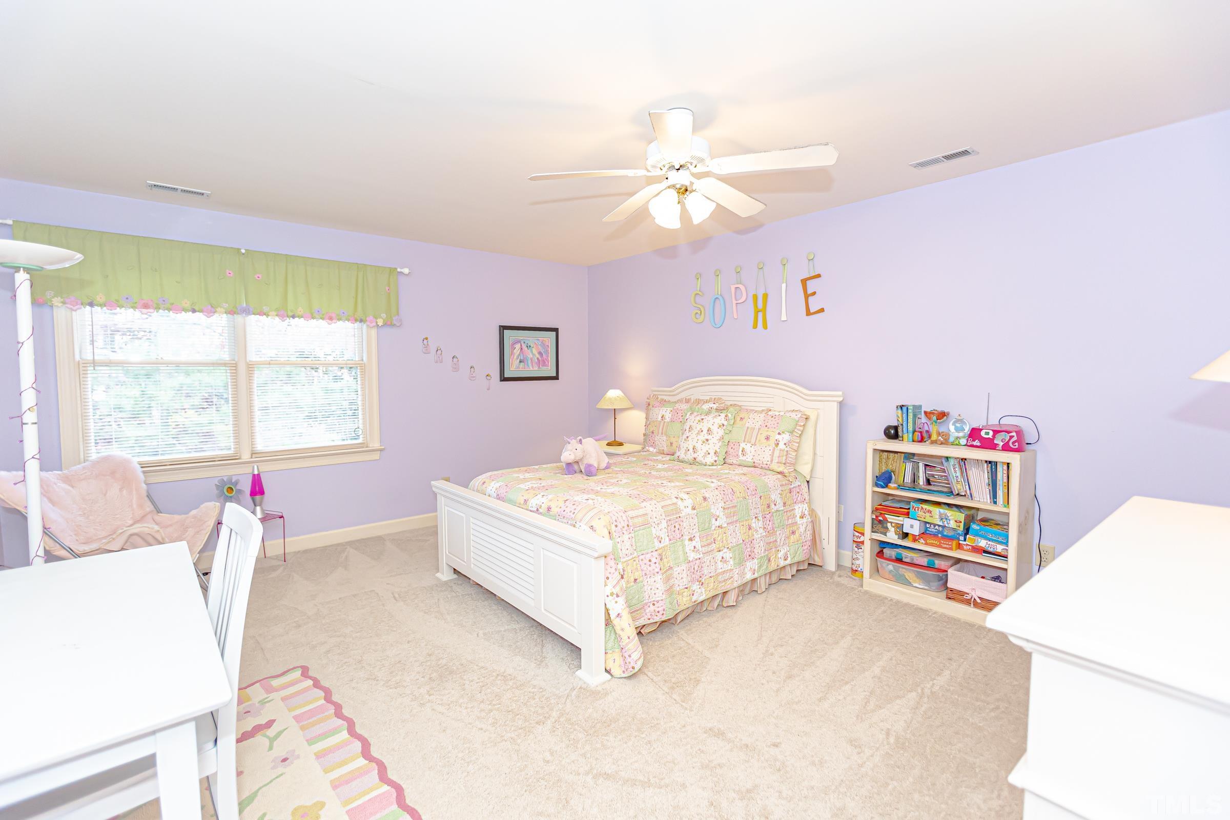 410 Weathergreen Drive Raleigh, NC 27615 - Photo 33 of 44 a bedroom with a bed dresser and a window