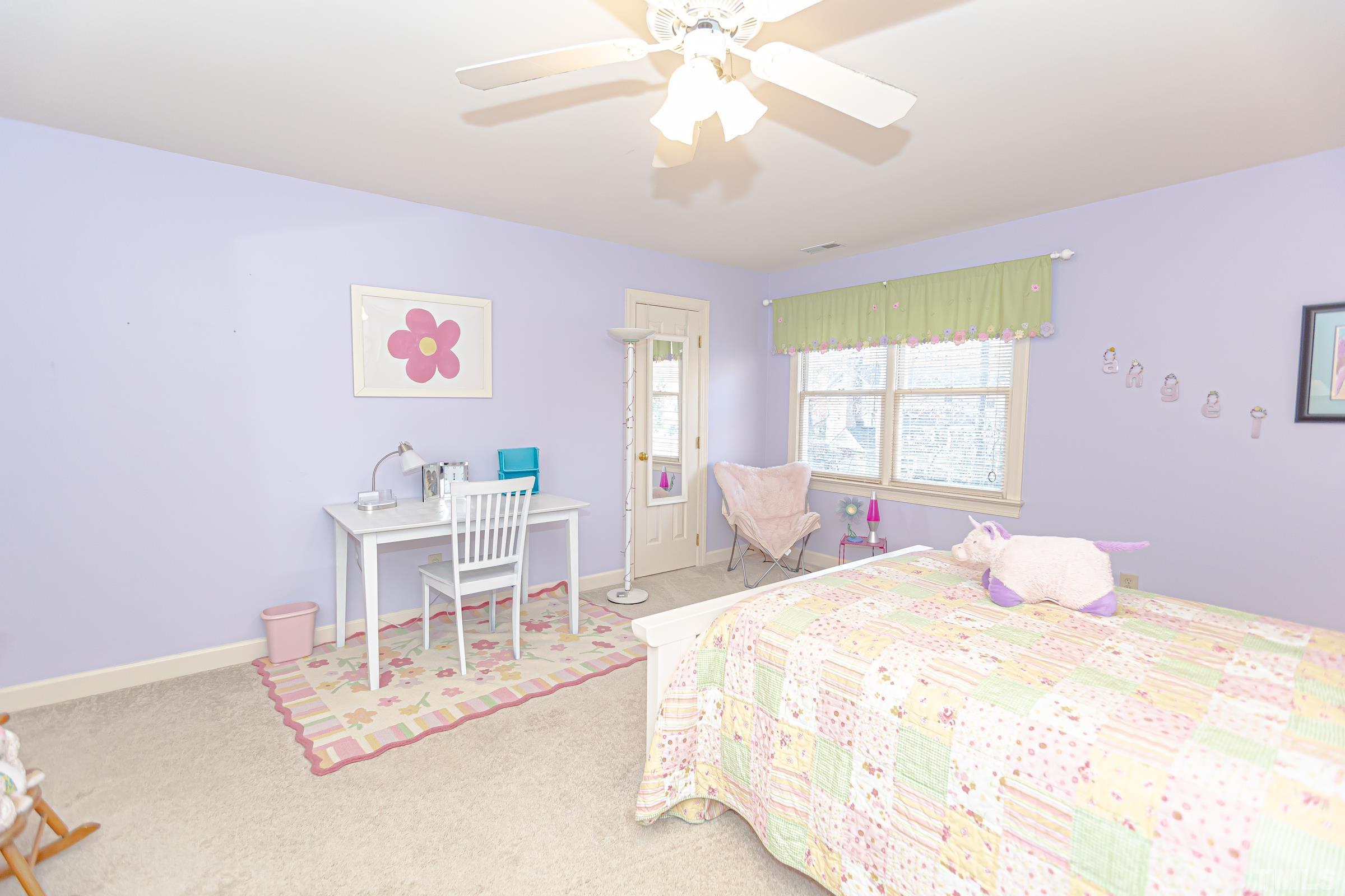 410 Weathergreen Drive Raleigh, NC 27615 - Photo 34 of 44 a bedroom with a bed and a table chair