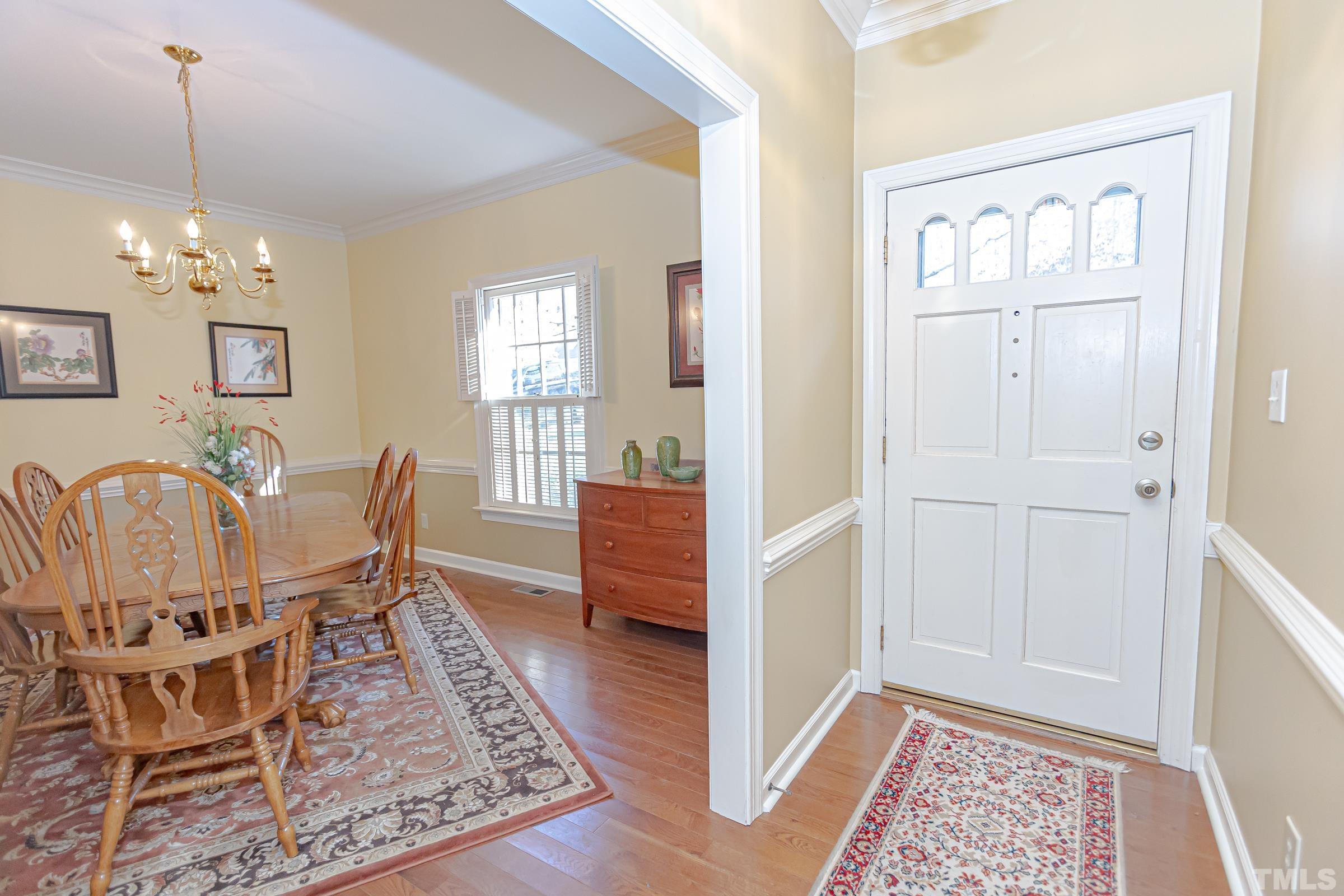 410 Weathergreen Drive Raleigh, NC 27615 - Photo 4 of 44 a view of a dining room with furniture