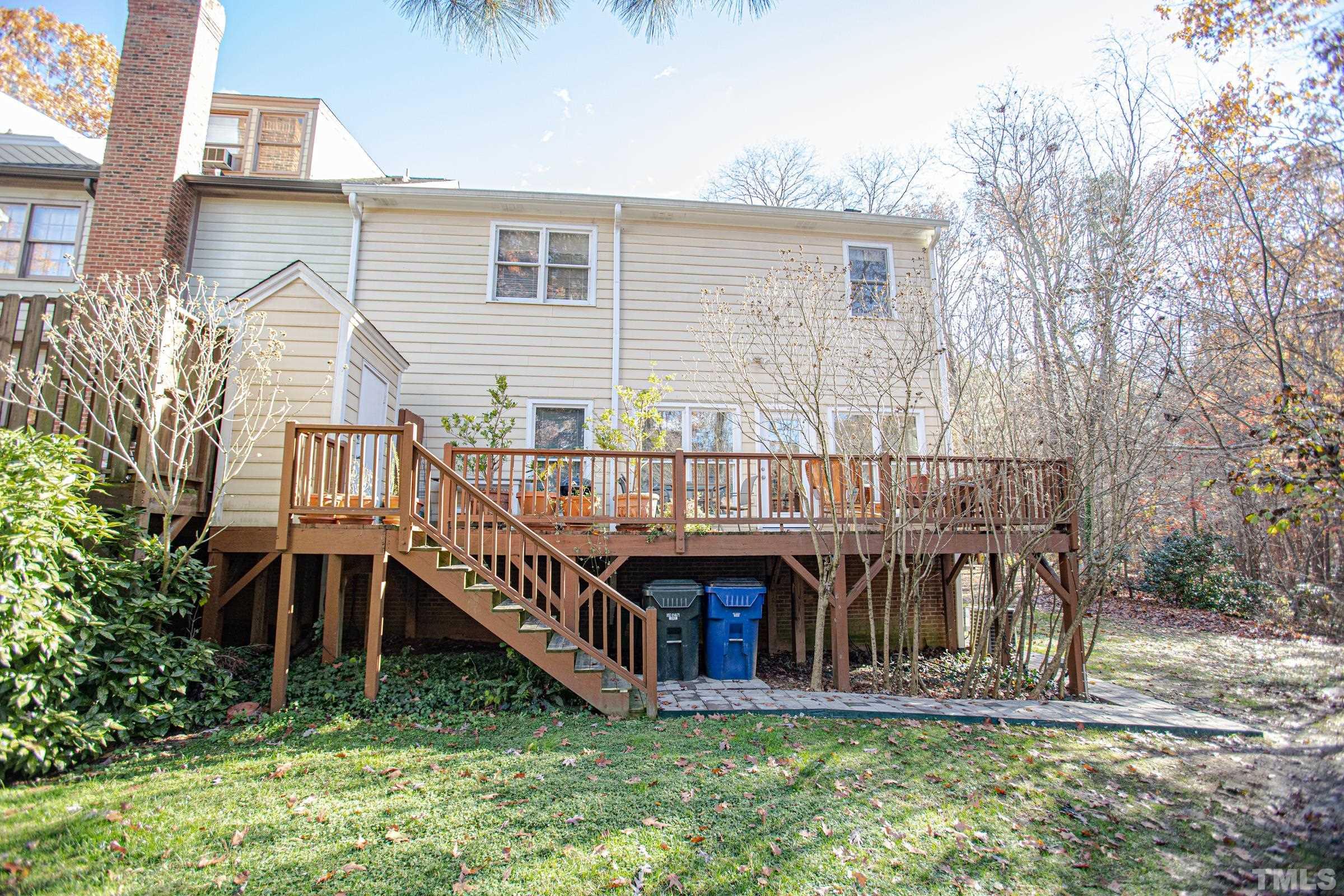 410 Weathergreen Drive Raleigh, NC 27615 - Photo 42 of 44 a view of a house with a yard and deck