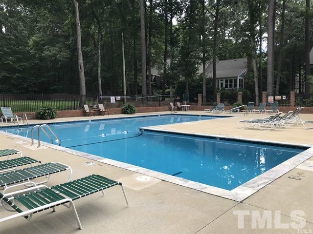 410 Weathergreen Drive Raleigh, NC 27615 - Photo 44 of 44 a view of a swimming pool with a patio