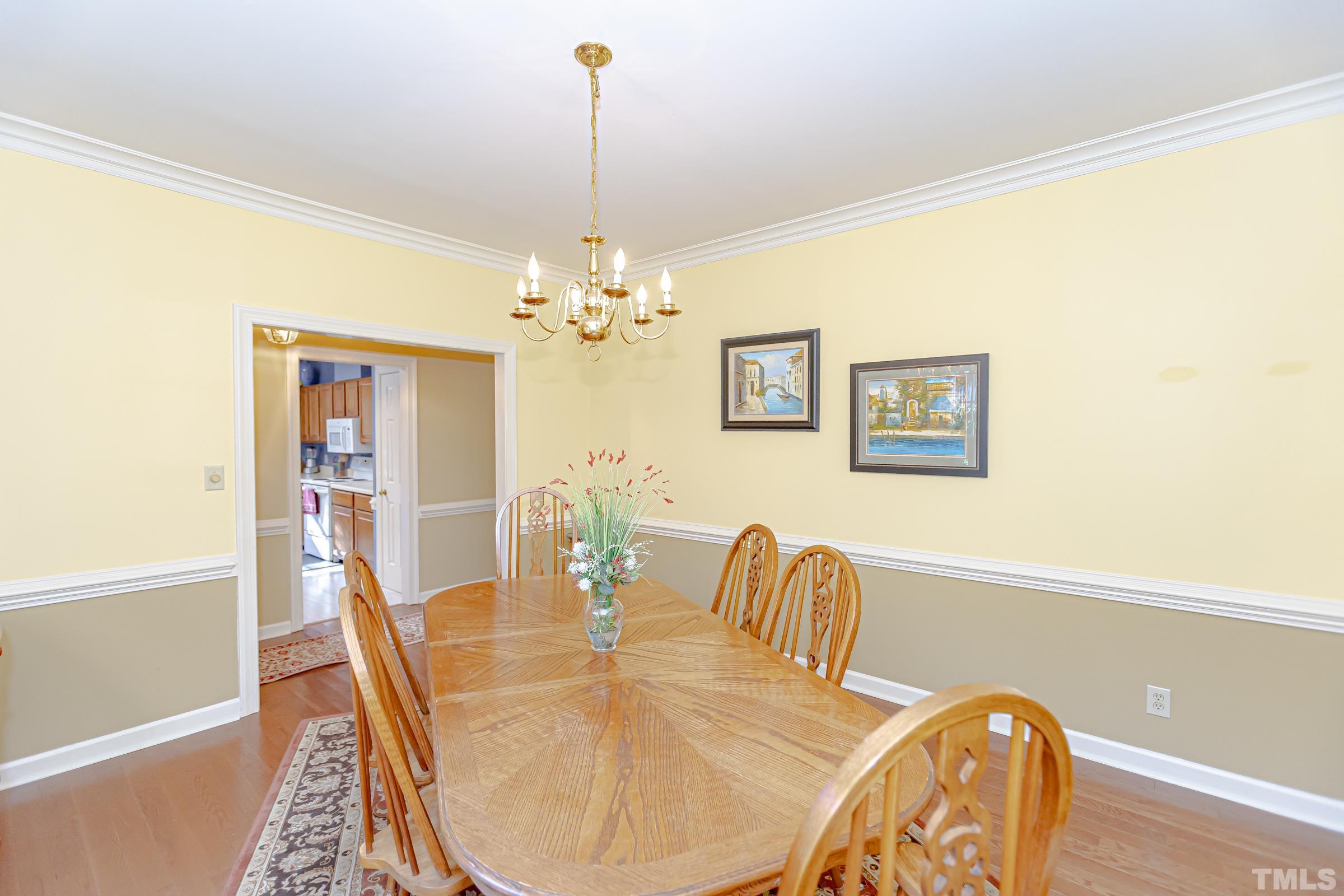 410 Weathergreen Drive Raleigh, NC 27615 - Photo 6 of 44 a dining room with furniture and window
