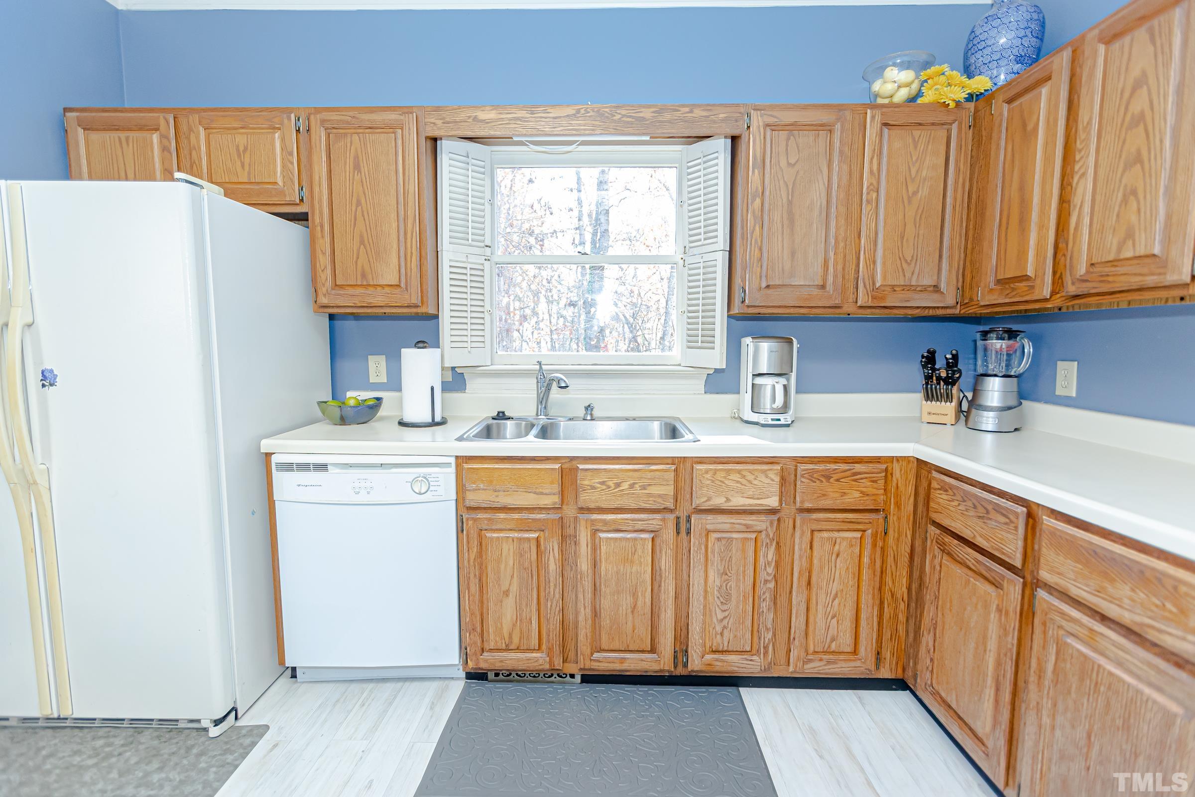 410 Weathergreen Drive Raleigh, NC 27615 - Photo 9 of 44 a kitchen with stainless steel appliances granite countertop a refrigerator sink and cabinets