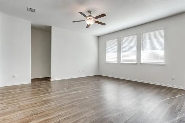 a view of kitchen with sink and wooden floor
