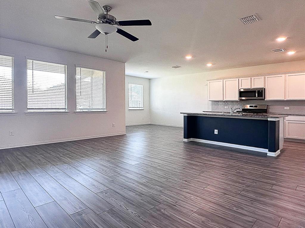 309 Hackberry Street Princeton, TX 75407 - Photo 12 of 28 a view of kitchen with sink and wooden floor