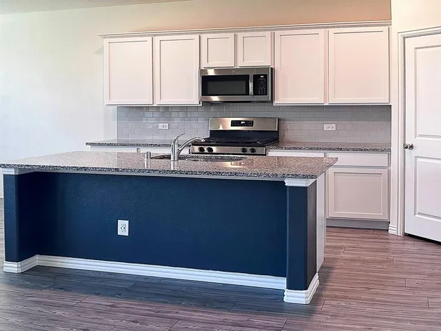 a bathroom with a sink double vanity and a mirror