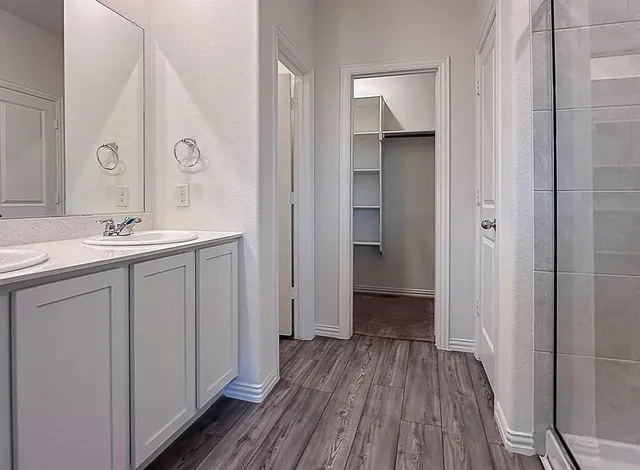 a view of a small space with wooden floor