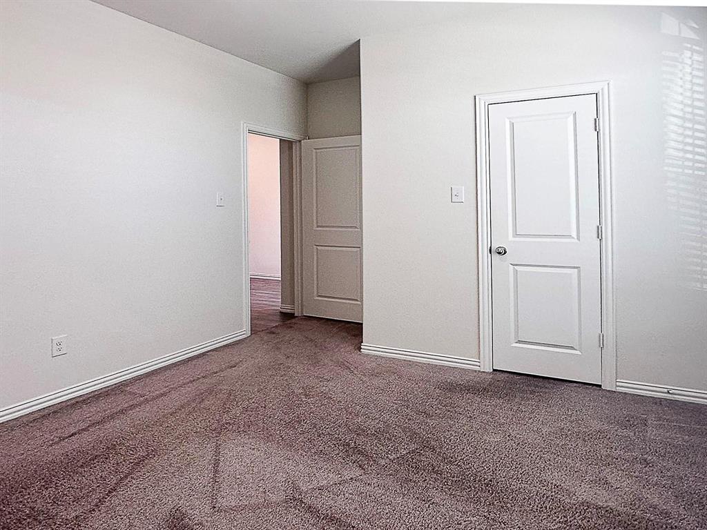309 Hackberry Street Princeton, TX 75407 - Photo 19 of 28 an empty room with closet area
