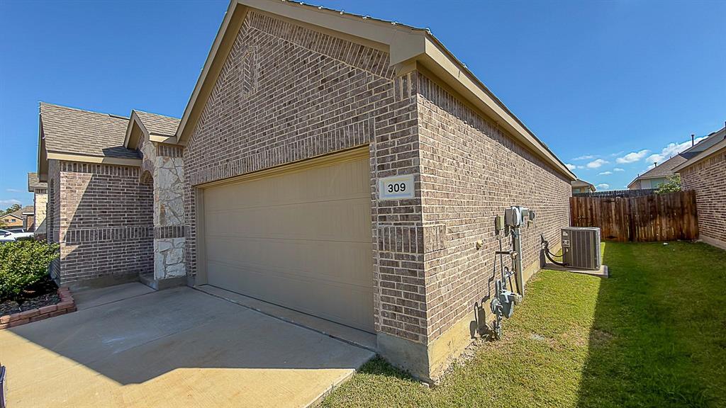 309 Hackberry Street Princeton, TX 75407 - Photo 2 of 28 a view of backyard of house