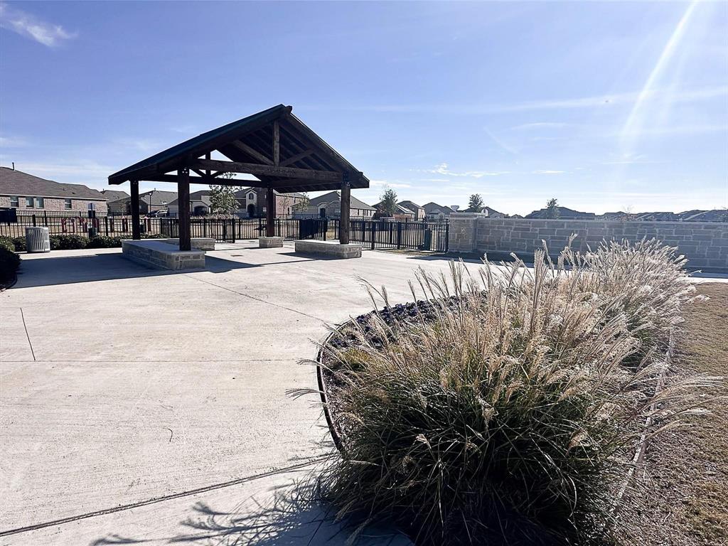 309 Hackberry Street Princeton, TX 75407 - Photo 23 of 28 a view of a house with a yard