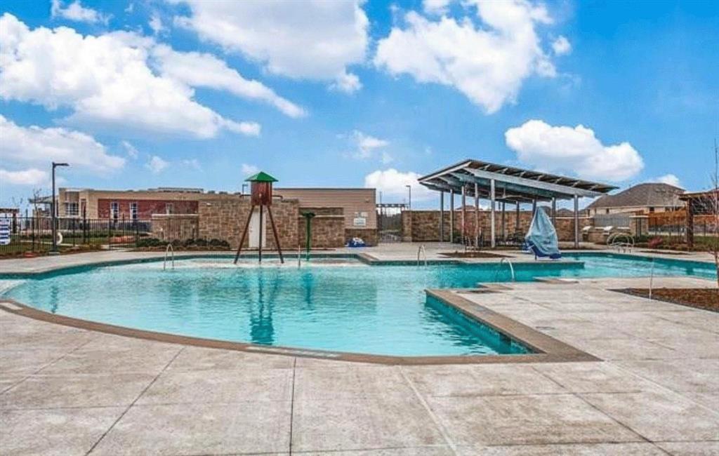 309 Hackberry Street Princeton, TX 75407 - Photo 24 of 28 a view of a swimming pool with a yard
