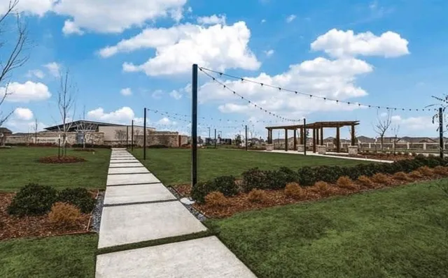 a patio with a table and chairs