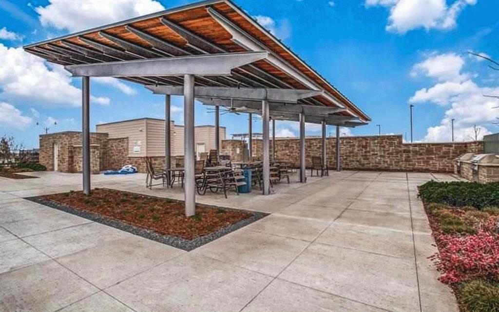 309 Hackberry Street Princeton, TX 75407 - Photo 28 of 28 a patio with a table and chairs
