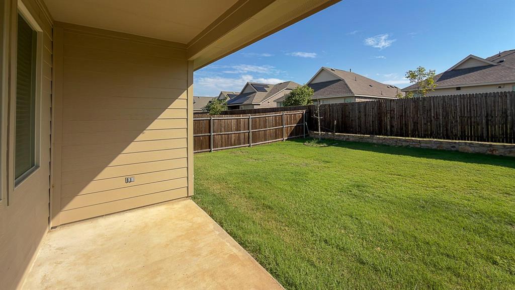 309 Hackberry Street Princeton, TX 75407 - Photo 5 of 28 a view of a backyard