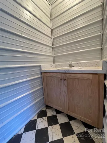 a room with a black white checkered floor