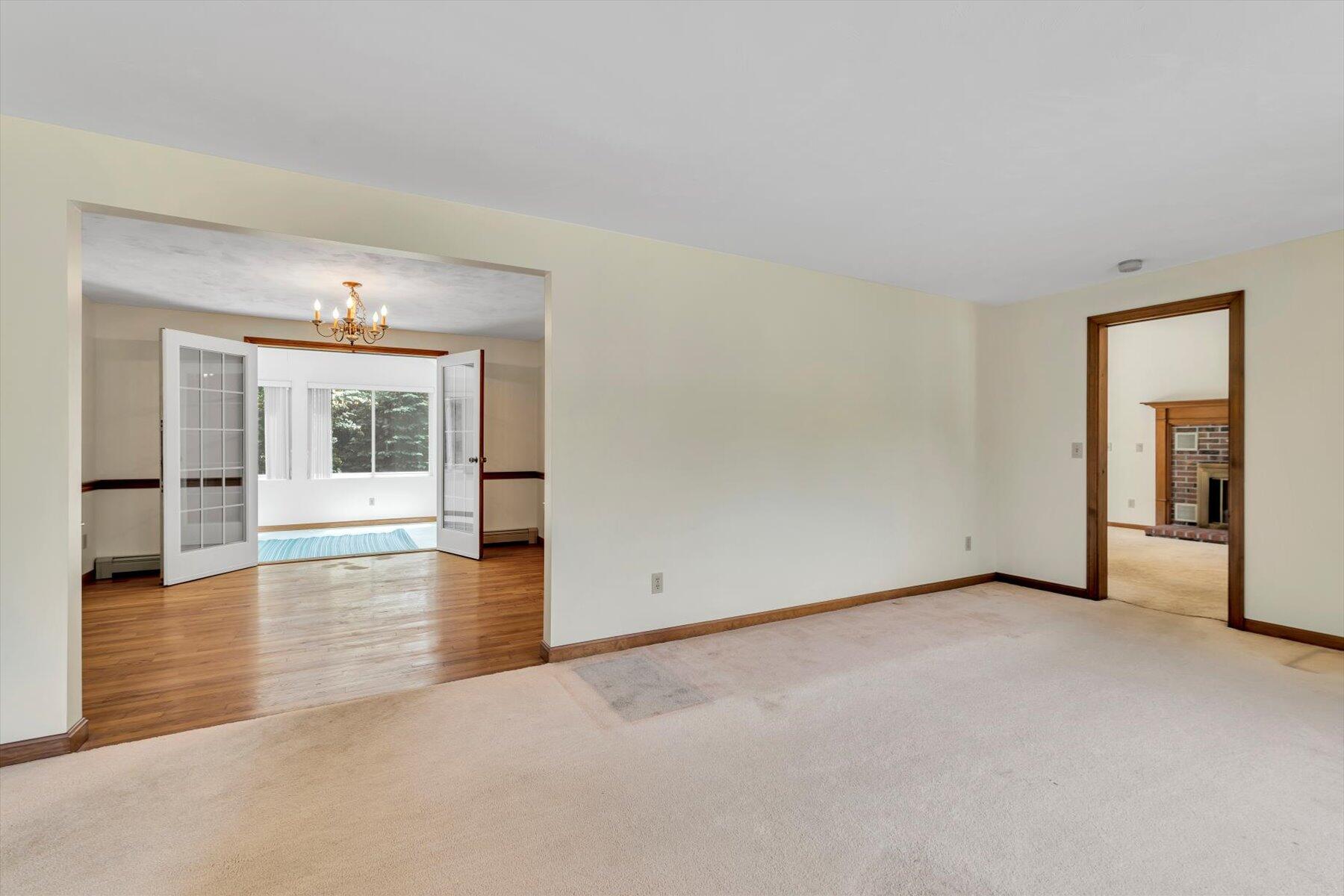 18 Pheasant Run Road Harwich, MA 02645 - Photo 16 of 51 a view of empty room with wooden floor and windows